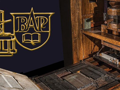 Vintage printing press with ornate logo, featuring BAP and book, symbolizing traditional book publishing.