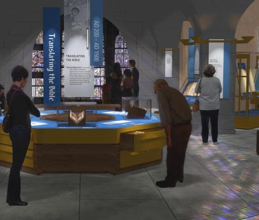 Visitors explore a Bible translation exhibit in a museum with interactive displays and historical artifacts.