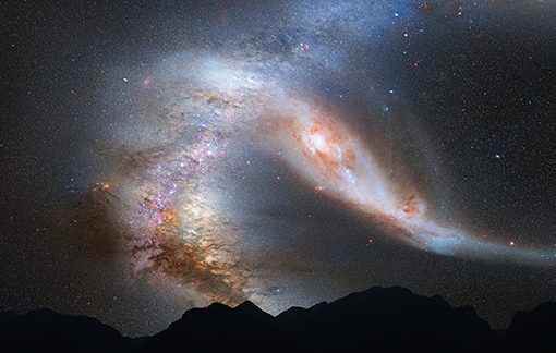 Collision of two galaxies in a starry night sky above silhouetted mountains.